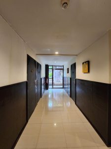Ground floor corridor at Club One Seven Guesthouse